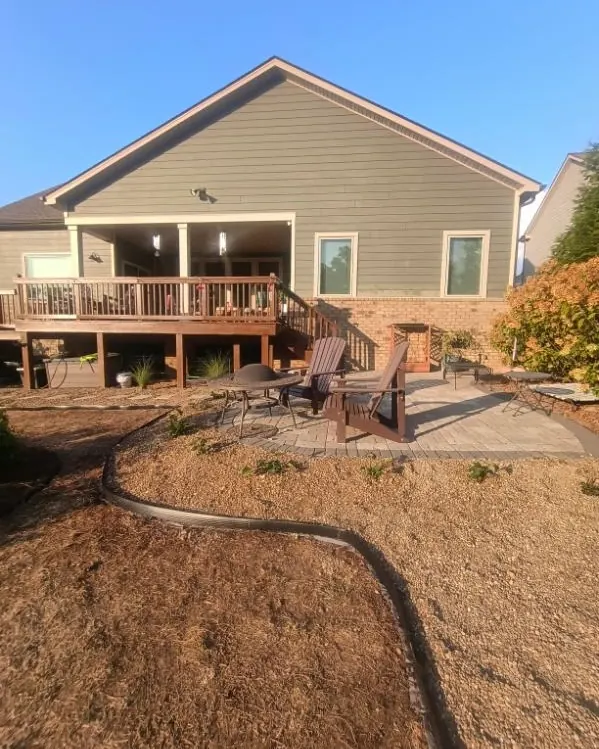 Patio pea gravel bed with landscape edging and newly planted Black-Eyed Susans in College Grove, Tennessee