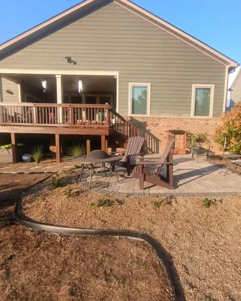 Finished patio pea gravel bed with Black-Eyed Susans and landscape edging in College Grove, Tennessee