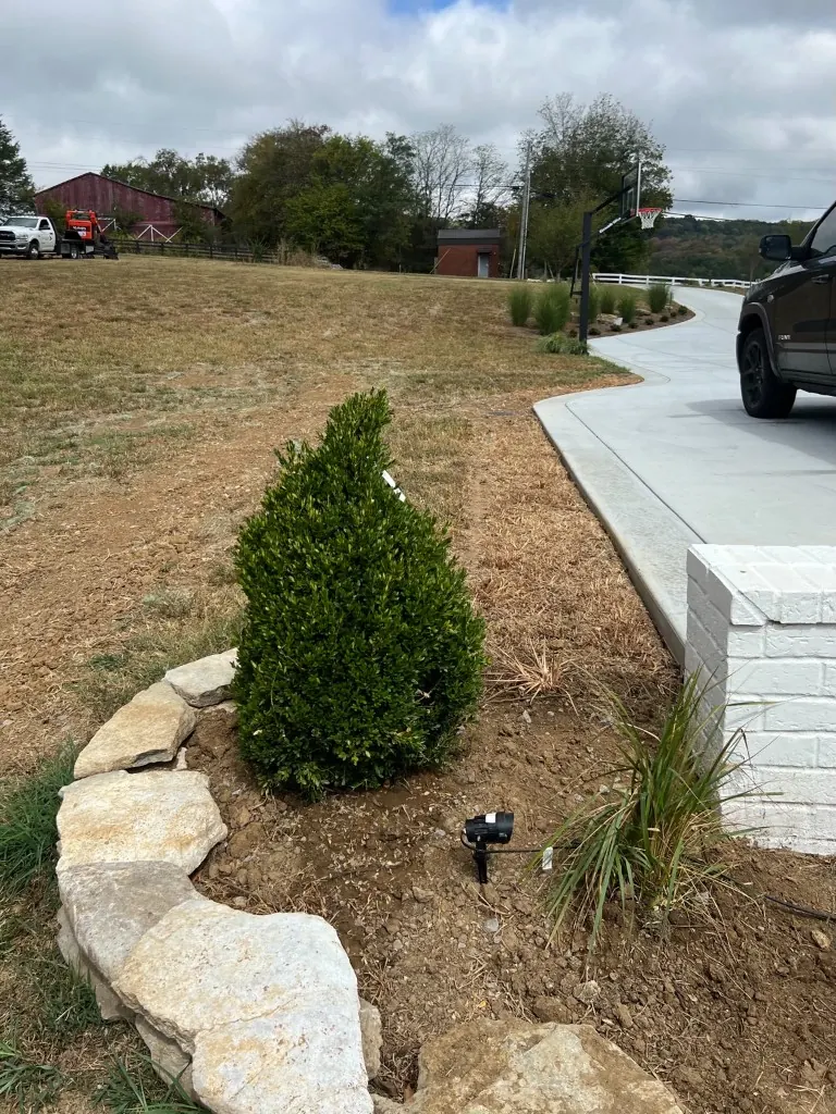 Second angle of the driveway drainage area before rock swale installation in College Grove, Tennessee
