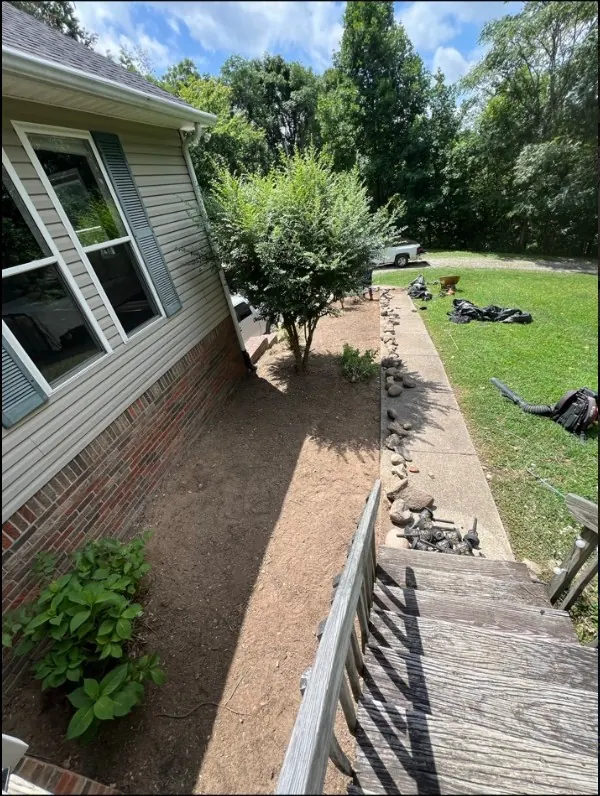 Landscape bed before mulch installation in Columbia, TN