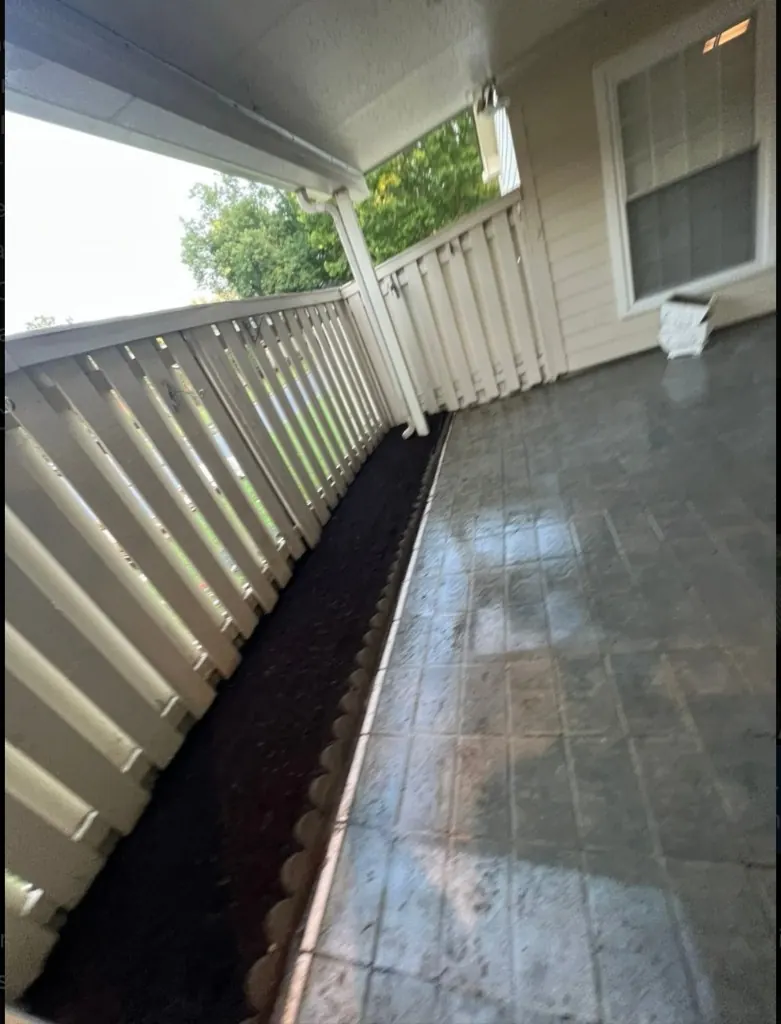 Patio after weed removal, mulch installation, and pressure washing in Franklin, TN