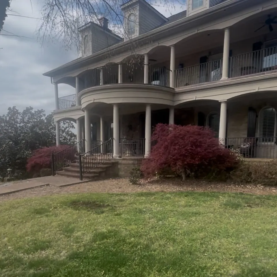 Front porch landscape bed before cleanup in Franklin, Tennessee
