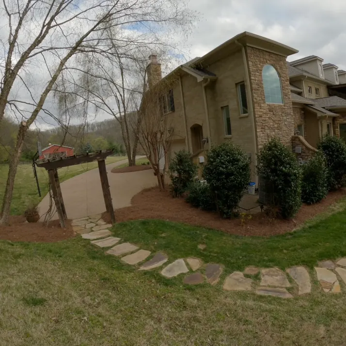 Pergola and path landscape beds with fresh pine straw in Franklin, Tennessee