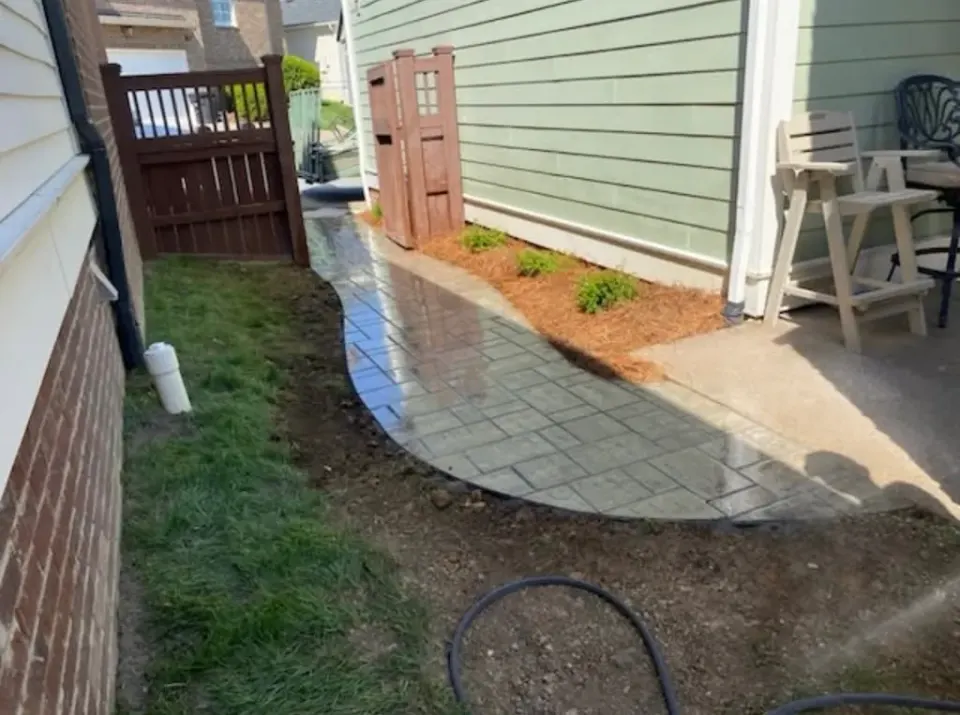 Curved hardscape walkway illustrating residential walkway design and installation services